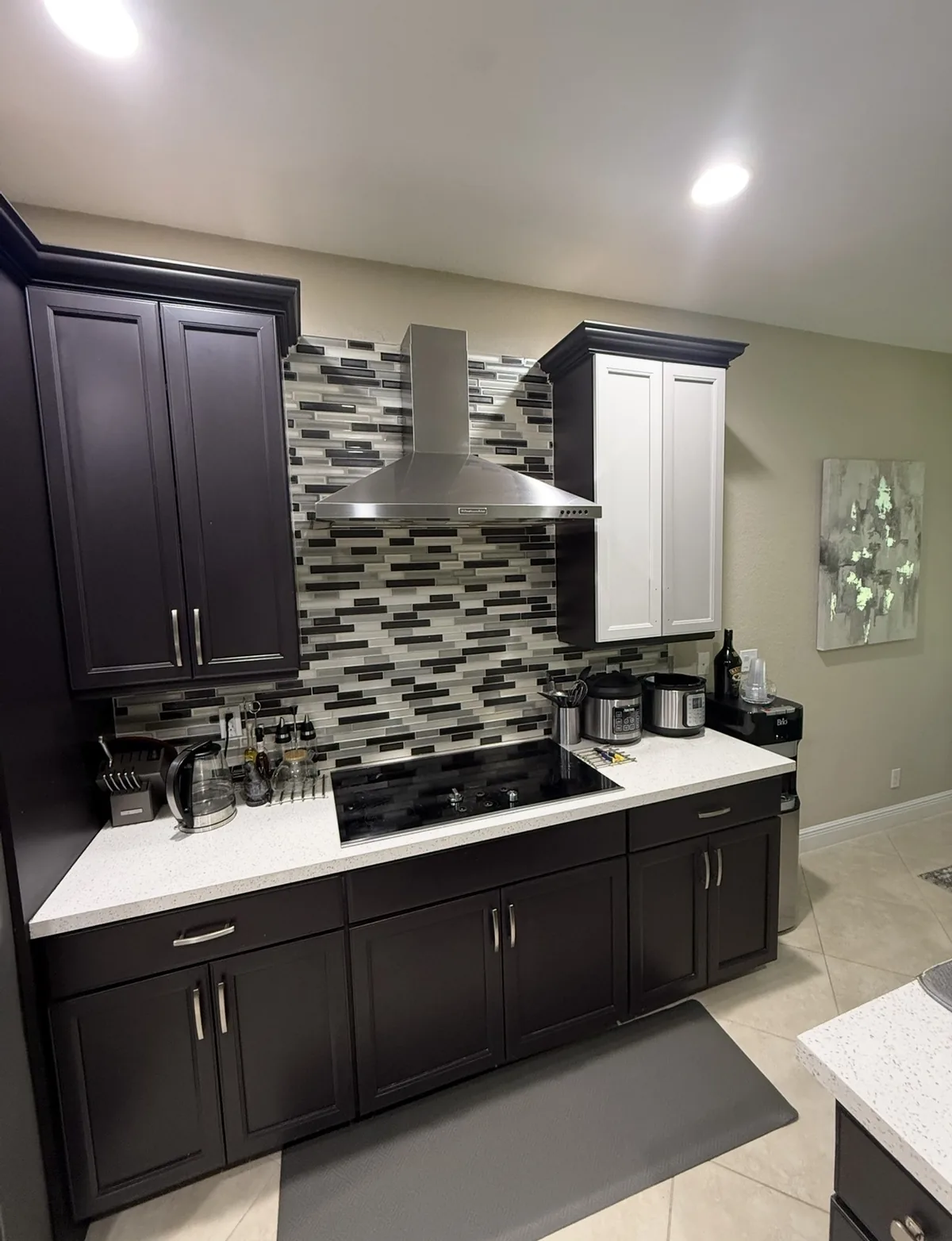 Espresso finished cabinets with tile backsplash