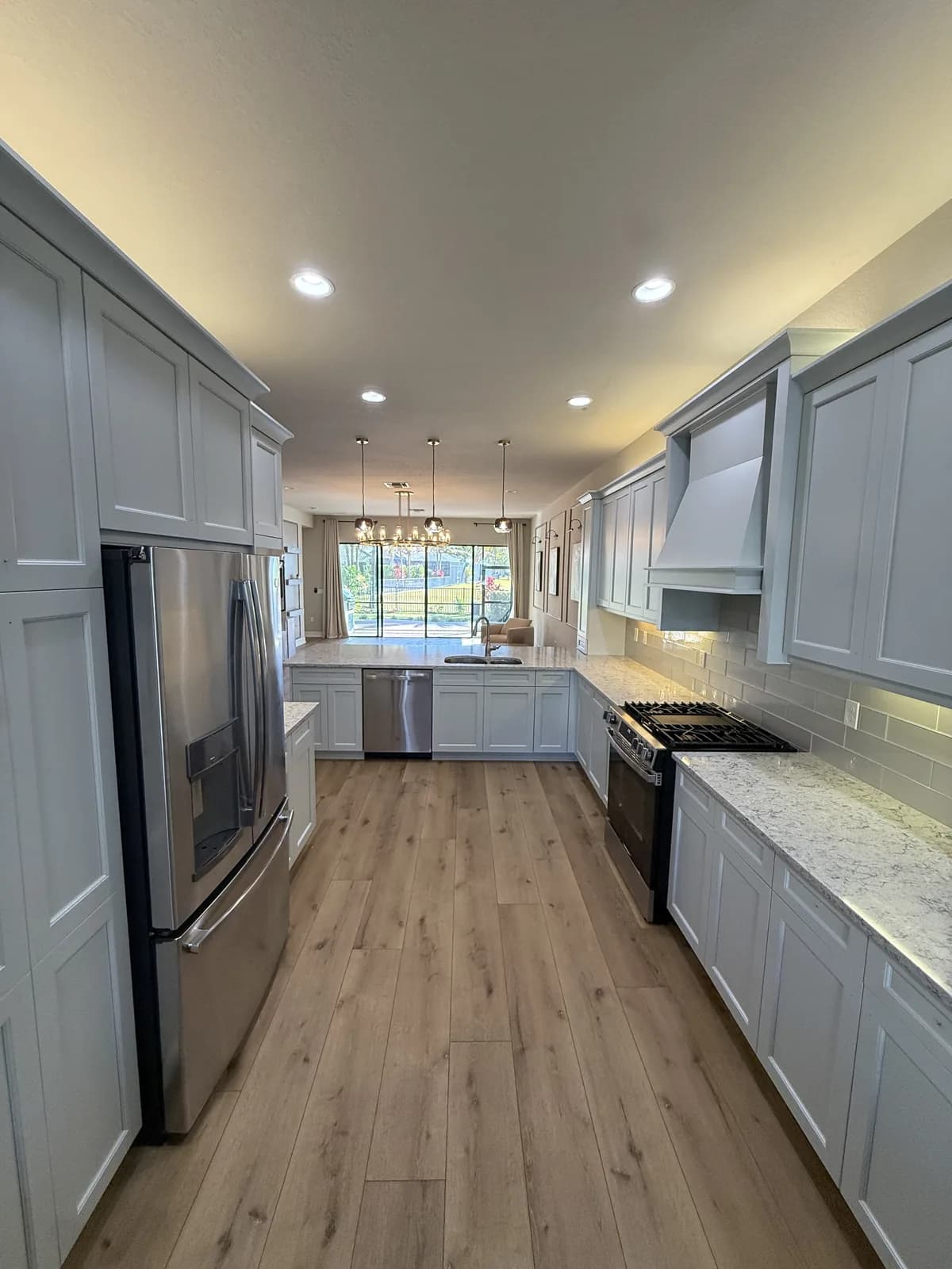 White shaker cabinets with stainless appliances